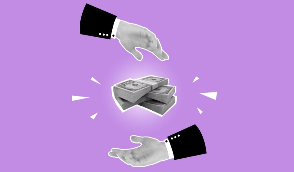 Cutout paper hands holding money against a pink background