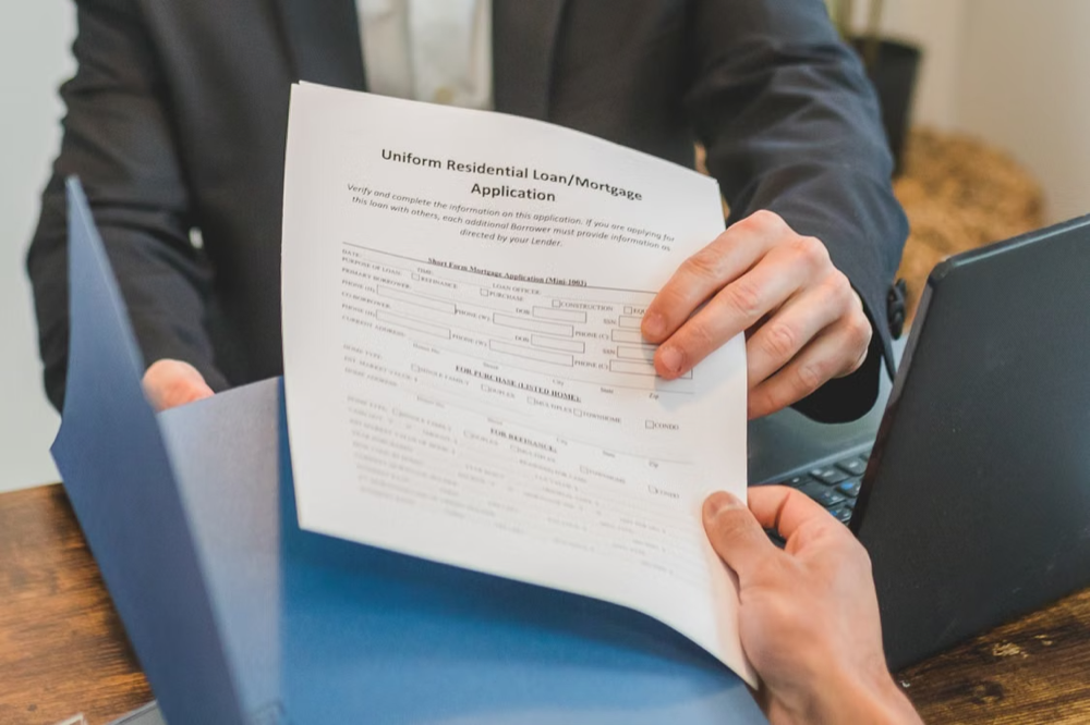 Person handing out a mortgage application