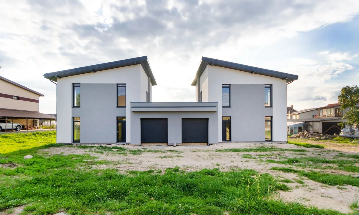 Modern twin house with a symmetrical design.